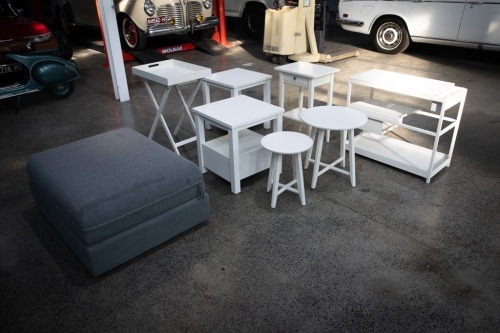 FURNITURE: A group of eight small white furniture items, includes a folding table, bedside table pair, two small stools and one trundle bed and some other items