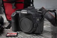 CAMERAS: Two Canon cameras, includes a 50D model with battery & strap and an older Canon instant camera - 2