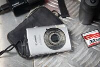 CAMERAS: Two Canon cameras, includes a 50D model with battery & strap and an older Canon instant camera - 3