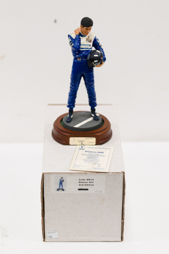 DAMON HILL: A 1:9 scale limited edition (536/5000) cold cast porcelain resin figure of Damon Hill sculpted by Paul Szeiler for Endurance Ltd, on wooden base with engraved plaque, NIB and accompanied by a COA from The Art of Sport, 22cm high [Location: Mel