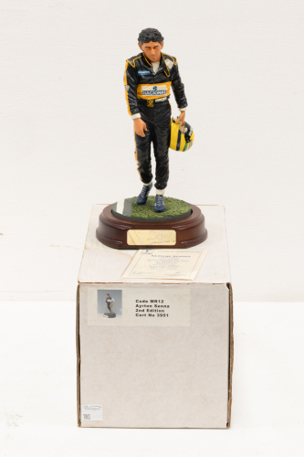 SENNA: A 1:9 scale limited edition (3951/5000) cold cast porcelain resin figure of Ayrton Senna sculpted by Paul Szeiler for Endurance Ltd, on wooden base with engraved plaque, NIB and accompanied by a COA from The Art of Sport, 22cm high [Location: Melbo