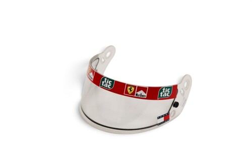 SCHUMACHER: A c1999-2001 Michael Schumacher Ferrari helmet visor with sponsorship stickers of Tic Tac, Marlboro & Tommy Hilfiger [Location: Melbourne]