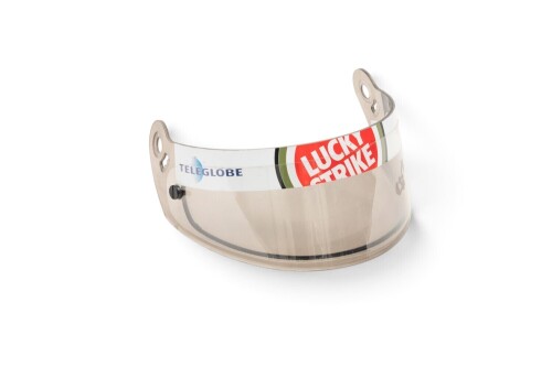 J VILLENEUVE: A c1999-2003 Jacques Villeneuve BAR helmet visor with sponsorship stickers of Lucky Strike & Teleglobe [Location: Melbourne]