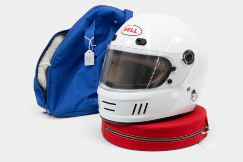 HELMET: A c1990s Bell visor helmet in RPM Racegear bag with padded neck brace [Location: Melbourne]