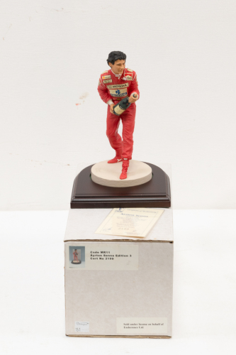 SENNA: A 1:9 scale limited edition (2199/7500) cold cast porcelain resin figure of Ayrton Senna sculpted by Tim Potts for Endurance Ltd, on wooden base with engraved plaque, NIB and accompanied by a COA from The Art of Sport, 22cm high [Location: Melbourn
