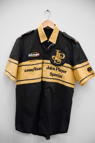 TEAM LOTUS: A c1985 Team Lotus mechanics shirt, made by Robin, branding by JPS, DeLonghi, Goodyear & Elf [Location: Melbourne]