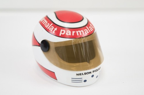 NELSON PIQUET: A small commemorative ceramic Nelson Piquet helmet, 11cm high [Location: Melbourne]