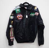 AUSTRALIAN GP: A jacket with numerous c1980s cloth patches mostly from the Australian Grand Prix in Adelaide & Melbourne, also has patches from F1 teams [Location: Melbourne] - 2