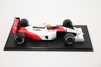 MCLAREN: A Tamiya Collector's Club 1:20 scale McLaren Honda MP4/6 car #1 as driven by Ayrton Senna model on base with nameplate in perspex case [Location: Melbourne]
