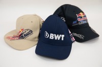 HATS: Three F1 hats, includes a Red Bull Racing hat, BWT hat & a Red Bull US Grand Prix hat [Location: Melbourne]