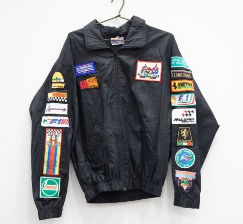 AUSTRALIAN GP: A jacket with numerous c1980s cloth patches mostly from the Australian Grand Prix in Adelaide & Melbourne, also has patches from F1 teams [Location: Melbourne]