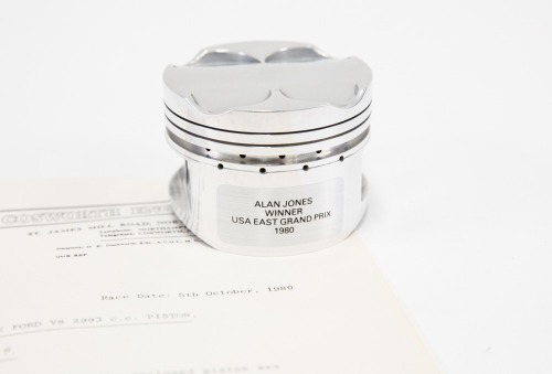 ALAN JONES: A commemorative piston released by Cosworth Engineering used by Alan Jones in his Williams FW 07/09 at the 1980 USA East Grand Prix [Location: Melbourne]