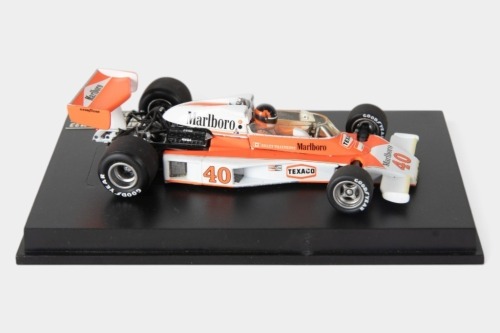 MCLAREN: A Minichamps 1:43 scale 1977 McLaren Ford M23 car #40 as driven by Gilles Villeneuve in perspex case [Location: Melbourne]