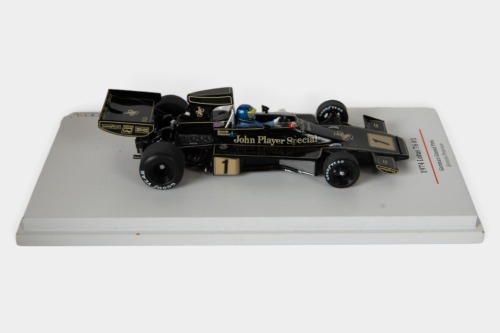 LOTUS: A TSM 1:43 scale 1974 Lotus 76 car #1 as driven by Ronnie Peterson in perspex case [Location: Melbourne]