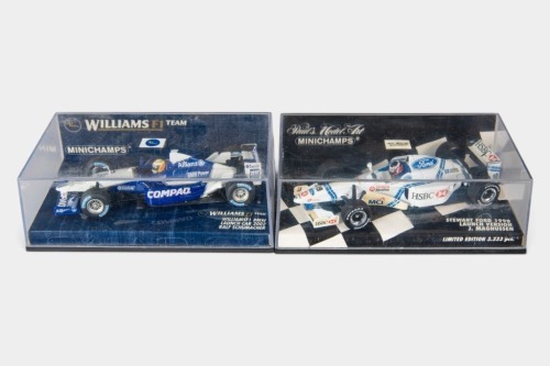 F1 MODELS: Two Minichamps 1:43 scale Formula One models in original perspex cases [Location: Melbourne]