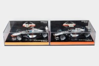 MCLAREN: Two Minichamps 1:43 scale McLaren team models in original boxes [Location: Melbourne]