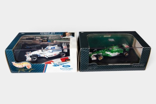 STEWART / JAGUAR: Two Hot Wheels Racing 1:43 scale Stewart & Jaguar team models in original boxes [Location: Melbourne]
