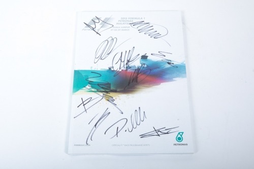 MALAYSIAN GP: A signed official programme for the 2015 Malaysian Grand Prix at Sepang, signed by an ensemble number of drivers [Location: Melbourne]