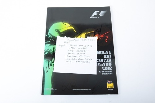 HUNGARIAN GP: An official signed programme from the 2012 Hungarian Grand Prix held at Hungaroring, signed by numerous drivers [Location: Melbourne]