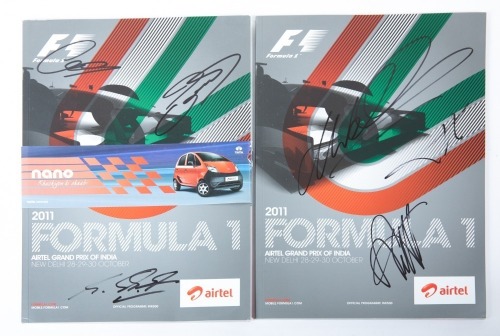 INDIAN GP: Two signed official programmes from the 2011 Indian Grand Prix [Location: Melbourne]