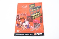 HUNGARIAN GP: An official signed programme from the 1997 Hungarian GP, signed on cover by Verstappen, Salo, Frentzen, Alesi, Herbert & Nakano [Location: Melbourne]