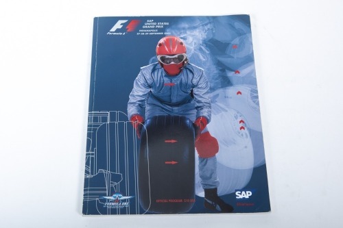 USA GP: An official signed programme from the 2002 USA Grand Prix at Indianapolis, signed by numerous drivers [Location: Melbourne]