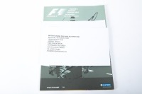 BRITISH GP: An official programme from the 2003 British GP at Silverstone, signed on cover by Schumacher, Button, Trulli, Raikkonen, Alonso, Coulthard, Panis & Barichello [Location: Melbourne] - 3