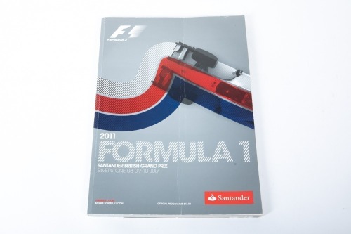 BRITISH GP: An official signed programme from the 2011 British GP at Silverstone, signed by many drivers such as Schumacher, Hamilton, Alonso, Button & more [Location: Melbourne]
