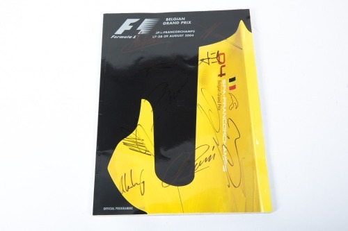 BELGIAN GP: An official programme from the 2004 Belgian Grand Prix at Spa, signed by numerous drivers such as Schumacher, Coulthard, Raikkonen, Alonso [Location: Melbourne]