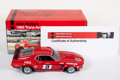 131 · FORD: A Welly 1:18 scale 1969 Trans-Am 'Coke' Mustang, car #9 driver Allan Moffat, box signed by Moffat, with COA in original box