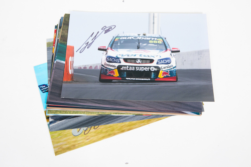 CRAIG LOWNDES: A group of 13, all signed, colour photographs of Craig Lowndes in various cars, all each individually signed by Lowndes, all 20cm high, 30cm wide