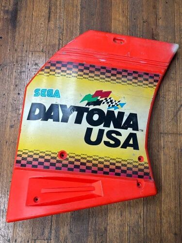 DAYTONA USA: A plastic side panel off a Daytona USA game