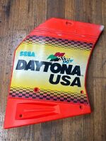 DAYTONA USA: A plastic side panel off a Daytona USA game