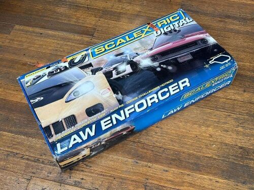 SCALEXTRIC: A 1:32 scale boxed triple car lineup Scalextric 'Law Enforcer' digital layout, with Corvette, Audi and Dodge, untested