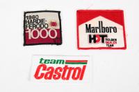 BATHURST: Three c1980 Bathurst drivers suit cloth patches, includes a Marlboro Holden Dealer Team patch, a Team Castrol patch & a 1980 Hardie-Ferodo 1000 patch