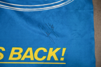 SETON: A Circa 1993 Ford, Peter Jackson Racing 'The Falcon V8 Is Back!' fabric flag on pole signed by Glenn Seton, measures 100cm high, 117.5cm wide overall - 2