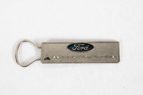 FORD: A c1980s 'Ford Australia - We're moving with you.' metal keyring tag, stamped to rear 'VIVIAN' measures approx 9.5cm long