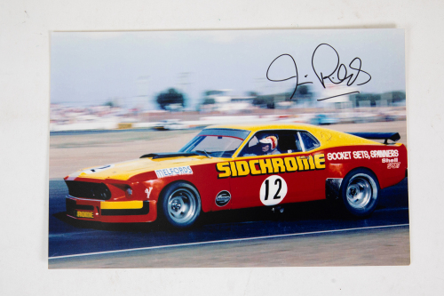 JIM RICHARDS: A signed photograph featuring Jim Richards driving the 'Sidchrome' Ford Mustang at Calder c1970s, signed by Richards, 20cm high, 30cm wide