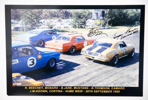 67 · HUME WEIR: A large signed colour photo featuring starting grid at 1969 Hume Weir race, signed by drivers Norm Beechey, Bob Jane & Bryan Thompson, 30cm high, 46cm wide
