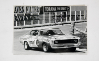 PHIL BROCK: A signed b/w photograph featuring Phil Brock driving Chrysler Charger at Bathurst 1000 c1973, signed by Brock, 20cm high, 30cm wide