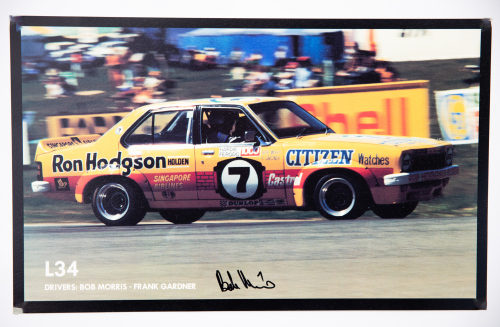 BOB MORRIS: A signed poster featuring Bob Morris driving Holden Torana L34 at Bathurst c1975, signed by Morris, 27cm high, 44cm wide