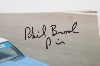 BROCK BROTHERS: A signed photograph featuring the 1977 'Brock Brothers' Holden Torana A9X racing at Bathurst, signed by Phil Brock, 20cm high, 30cm wide - 2