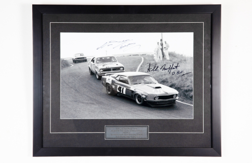 96 · BEECHEY / MOFFAT: A signed b/w photograph featuring Norm Beechey chasing Allan Moffat at 1970 Round Two A.T.C.C at Bathurst, signed by Beechey & Moffat, 50cm high, 62cm wide overall
