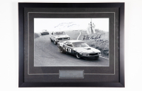 BEECHEY / MOFFAT: A signed b/w photograph featuring Norm Beechey chasing Allan Moffat at 1970 Round Two A.T.C.C at Bathurst, signed by Beechey & Moffat, 50cm high, 62cm wide overall