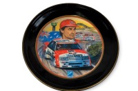 PETER BROCK: A decorative dinner plate set, each plate featuring the Peter Brock Bathurst wins, consists of 10 plates of differing sizes - 7