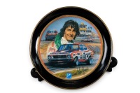 PETER BROCK: A decorative dinner plate set, each plate featuring the Peter Brock Bathurst wins, consists of 10 plates of differing sizes - 11