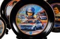 PETER BROCK: A decorative dinner plate set, each plate featuring the Peter Brock Bathurst wins, consists of 10 plates of differing sizes - 14