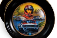 PETER BROCK: A decorative dinner plate set, each plate featuring the Peter Brock Bathurst wins, consists of 10 plates of differing sizes - 15