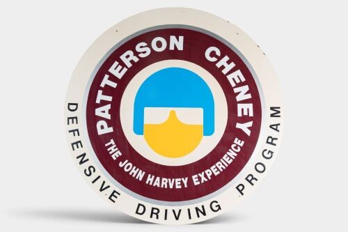 JOHN HARVEY: An original 1980s Patterson Cheney 'The John Harvey Experience - Defensive Driving Programme' sign as hung in the Ringwood Dealership, believed to be one of two signs, measures 100cm in diameter