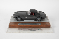 BMW: A 1:18 scale model of a BMW 507, mounted on a timber and perspex base with plaque 'BMW FIVA World Rally 1993 Tasmania, 3rd Place - Concours d&rsquo;Elegance Vintage' [Location: Melbourne]